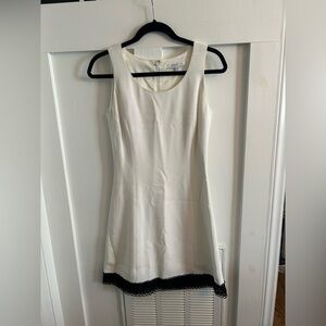 Andrew GN white shift dress with black lace trim